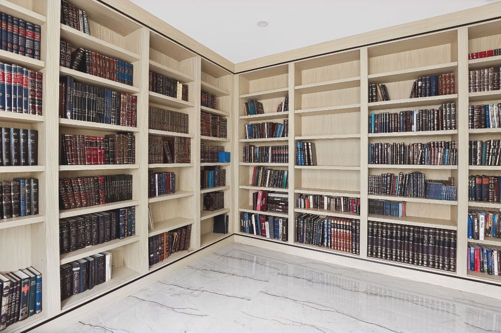 Wraparound light oak bookcases in a home study