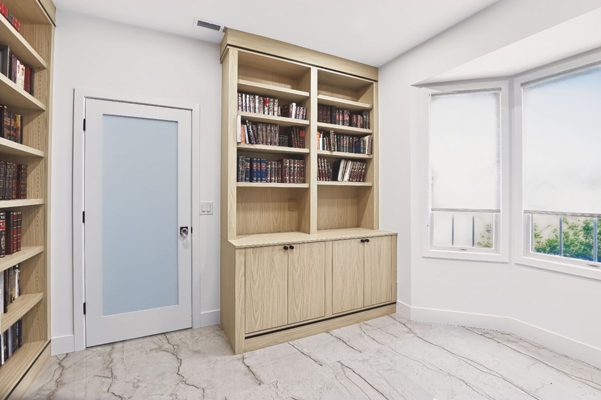 MelaWood bookcase and cabinet unit beside a window